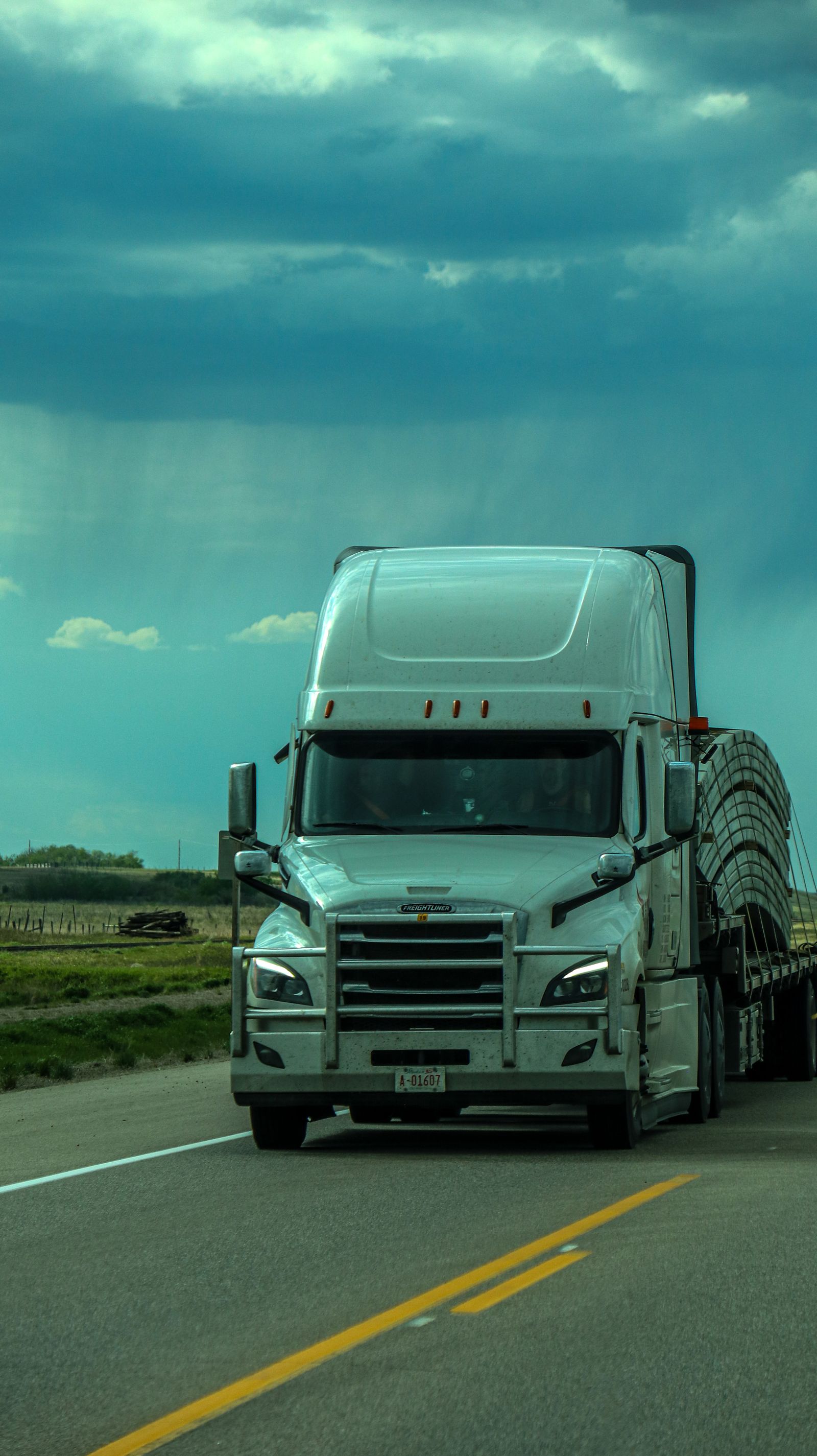 Freightliner Cascadia semi truck hauling freight