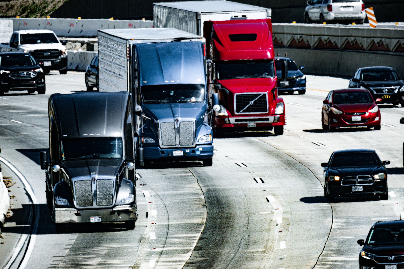 Semi trucks moving quickly on a U.S. interstate
